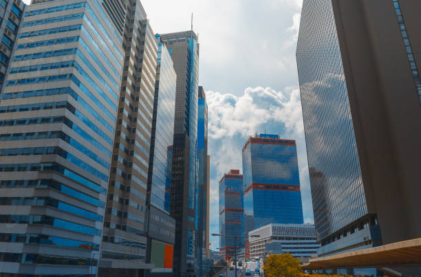 istock Bottom up view of Modern office building in Hong Kong 1018603292