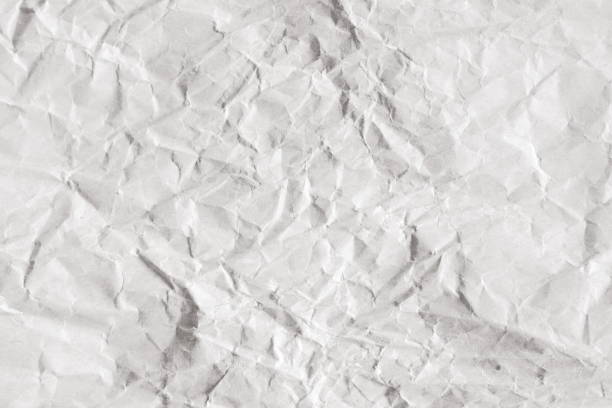 istock Background of old crumpled craft package wrapping paper texture 1018615748