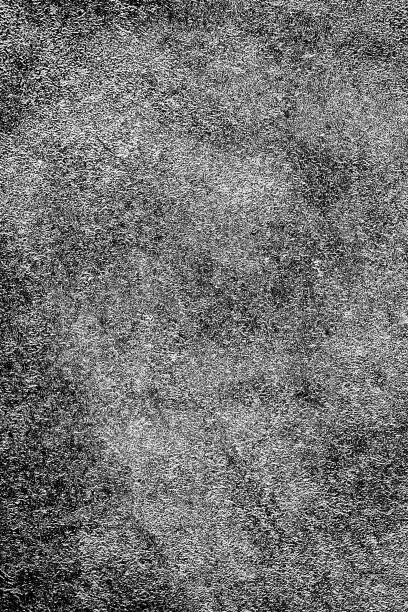 istock Grunge background black and white. Abstract monochrome texture. Pattern of cracks, chips, scuffs, scratches, cracks. Vintage dirty surface covered with dust and stains 1018615894