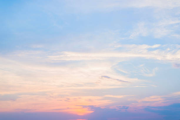 istock Stunning clouds and orange sunset in the bright sky 1018623928