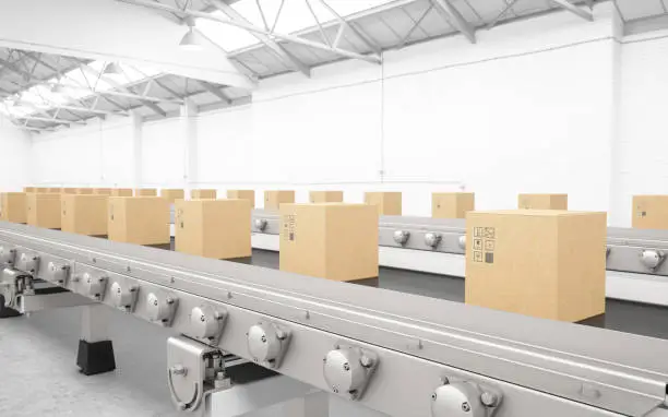 Photo of Cardboard boxes on conveyor belt