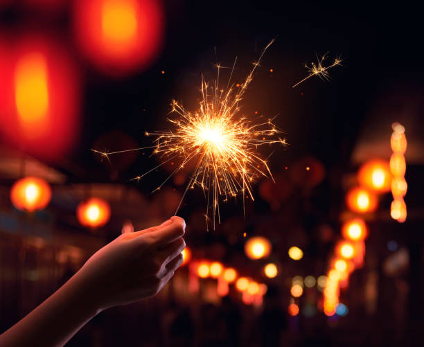 istock Hand holding a sparkler during Chinese New Year celebration 1018631838