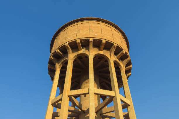 Johannesburg , Gauteng / South Africa -August 02 2018 :water tower/reservoir, low angle horizontal shot, blue sky in the background , daytime warm light