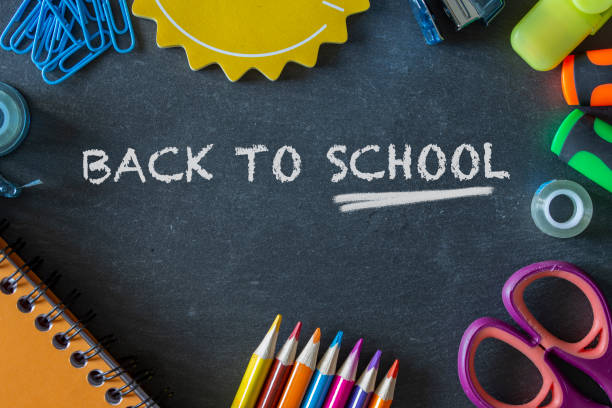 istock Back to school supplies on dark background. 1018636468