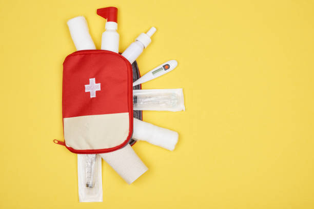istock top view of first aid kit with various medicines isolated on yellow 1018644556