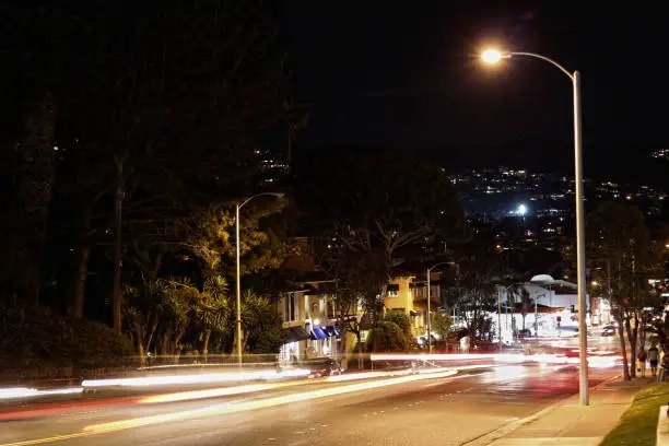 Headlight and car trails through the night in Laguna Beach California.