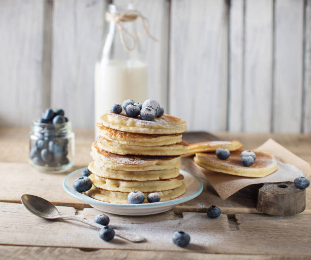 istock Some pancakes with blueberry on the wood table 1018651750