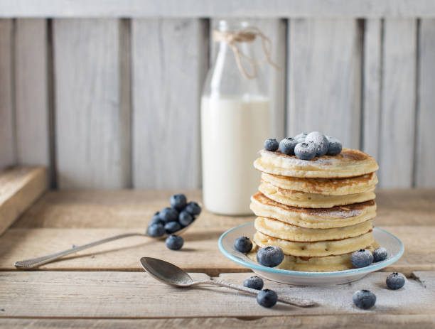 istock Some pancakes with blueberry on the wood table 1018651760