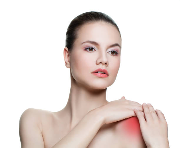 istock Woman with sore shoulder isolated on white background 1018652550