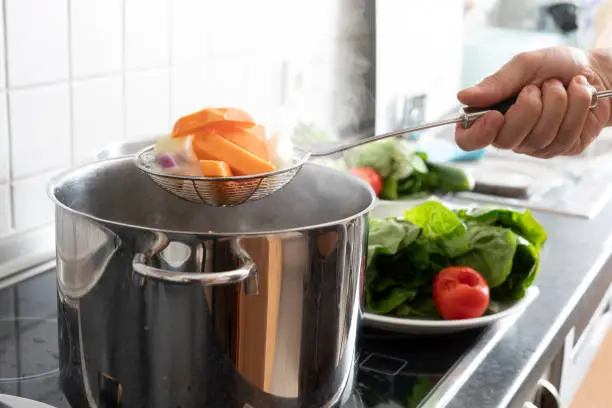 Photo of Blanching vegetables in large cooking pot