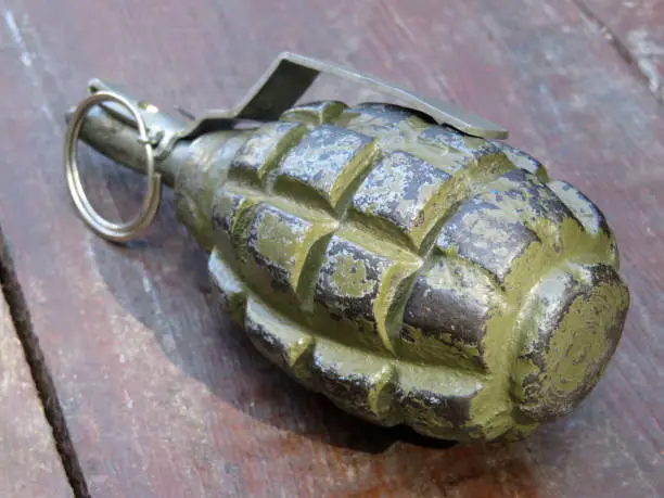 Photo of Soviet and russian hand grenade F-1 on wooden table