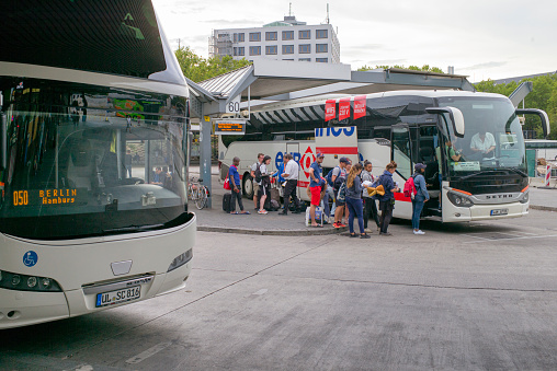 Berlin, Germany - August 13, 2018: Berlin ZOB (Central Bus Station) people stand in queue and wait for boarding a bus from the Bulgarian company Eurolines