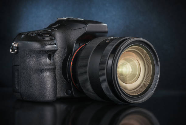 istock Studio shot of a digital SLR camera with a lens. 1018663324