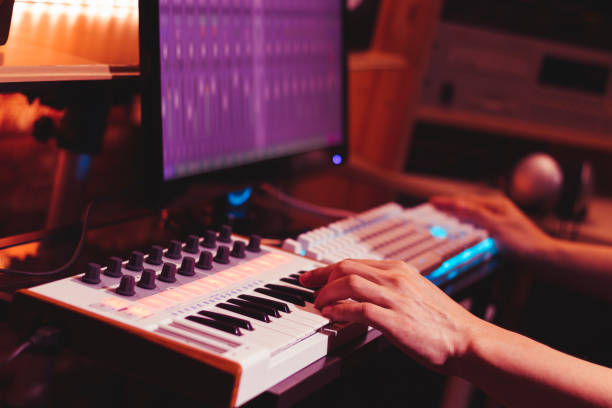 istock musician hands playing midi keyboard synthesizer for recording music on computer in digital sound studio 1018663470