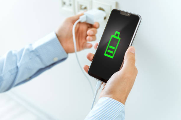Smartphone charging Smartphone charging battery charger photos stock pictures, royalty-free photos & images