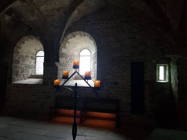 istock candles in an abbey 1018683298