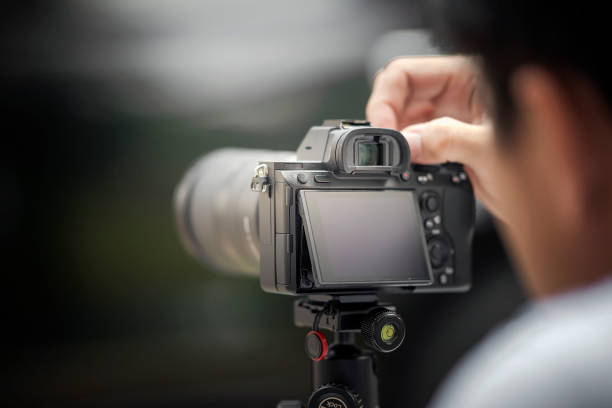 istock The photographer taking a photo with digital camera 1018683854