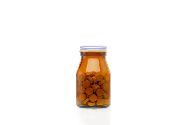 istock pills in glass bottle 1018688922