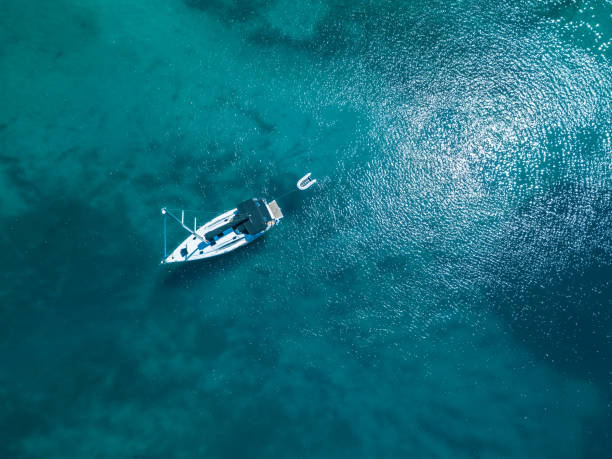 istock Anchored sailboat, view from drone 1018696964