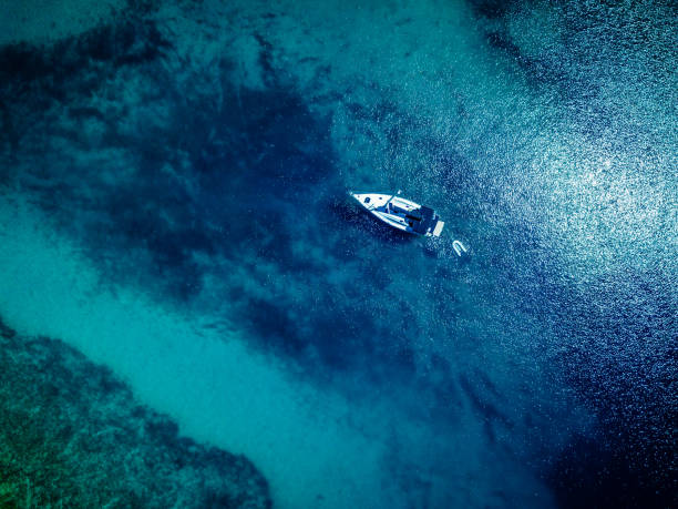 istock Anchored sailboat, view from drone 1018697054