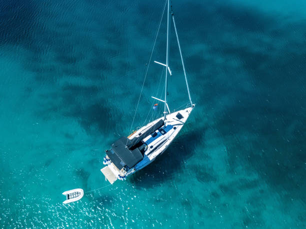 istock Anchored sailboat, view from drone 1018697064