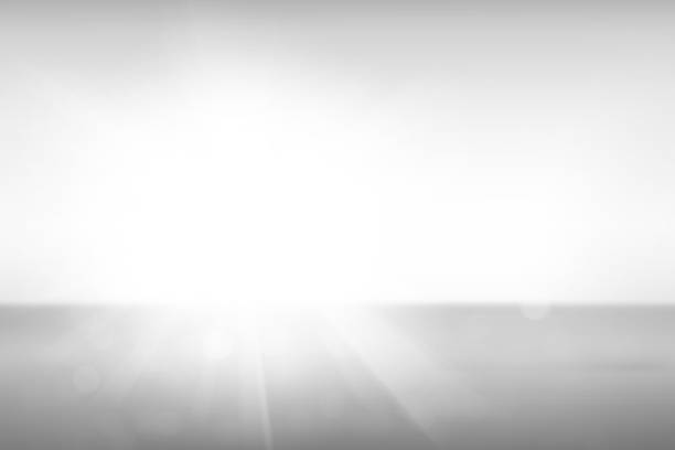Abstract blurred bokeh and sun ray on white and gray gradients background. Abstract bokeh and sun ray on gray background