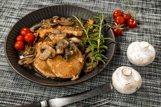 istock Braised pork chop with mushrooms. 1018707422