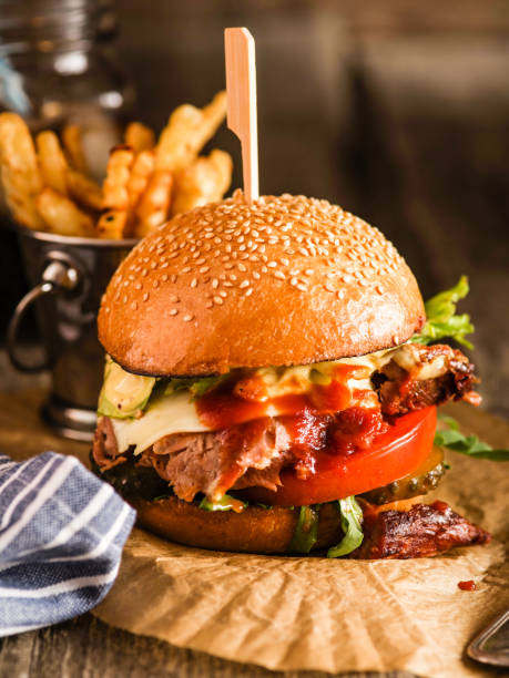 istock Freshly cooked homemade burger with chopped beef, cheese and fresh herbs. 1018713322
