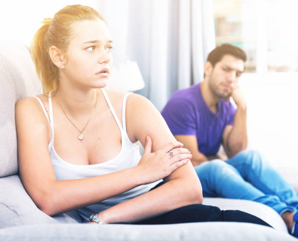 istock Woman on sofa after quarrel with husband 1018718160
