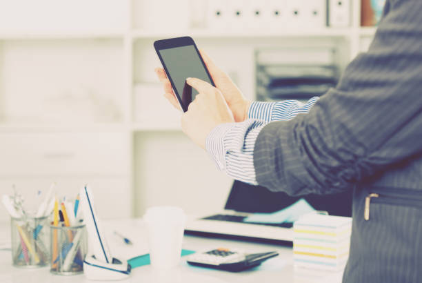 istock Businesswoman using smartphone 1018719224
