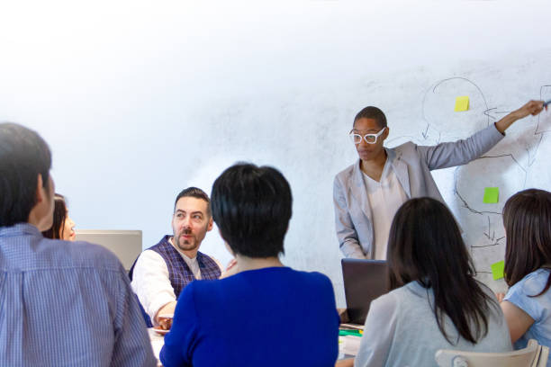 istock Businesswoman giving presentation 1018727840