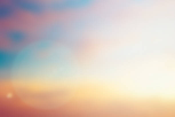 istock blurred beautiful natural pastel background lens ray flare flash light. 1018728676
