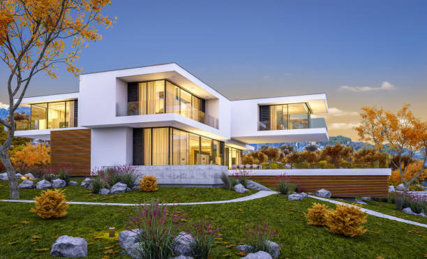 istock 3d rendering of modern cozy house by the river. Cool autumn evening with soft light. 1018731272
