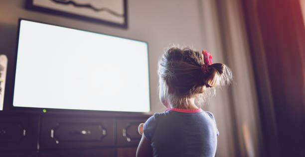istock Little girl staring at TV 1018736216