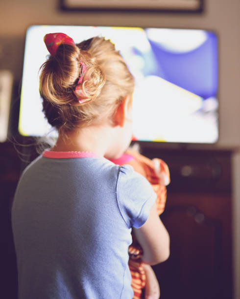 istock Little girl staring at TV 1018736268