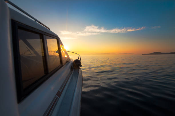 istock Motorboat moving to sunset 1018738516