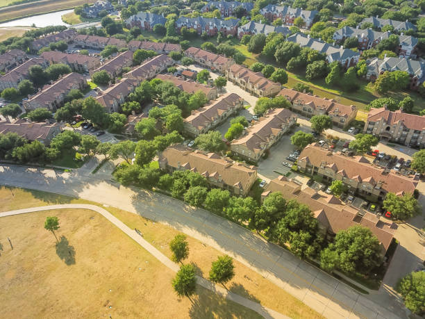 istock Aerial view apartment complex building, canal and park 1018742508