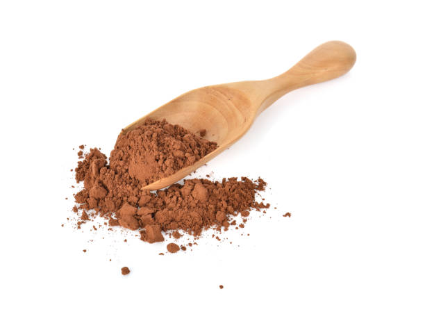 istock Cocoa powder in wooden spoon on white background 1018745742