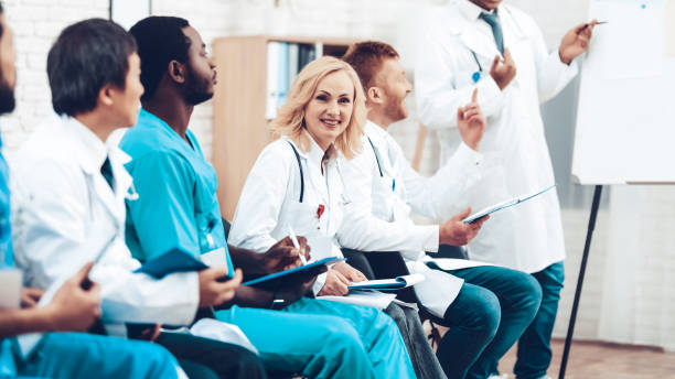 istock Female Doctor Camera Staring During The Lecture. 1018745846