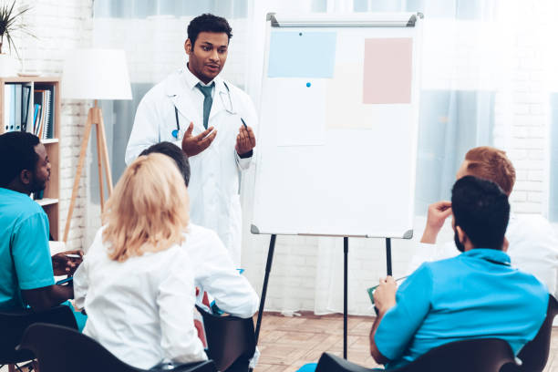 istock Indian Doctor Shares Experience With Colleagues. 1018745860
