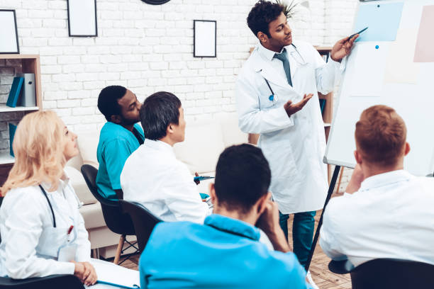 istock Indian Doctor Shares Experience With Colleagues. 1018745868