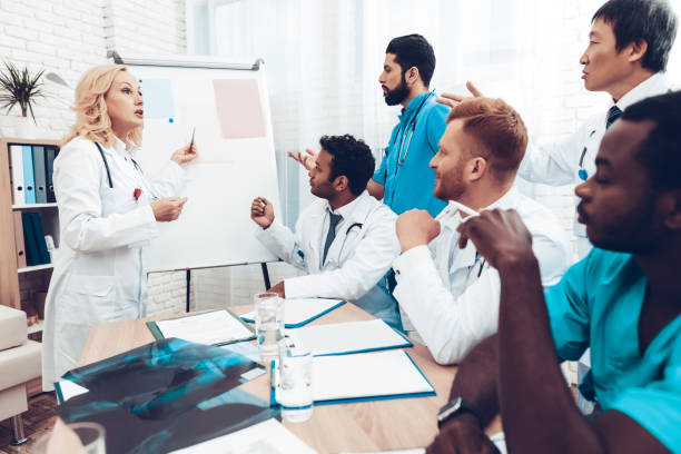 istock Teamwork Medical Consultation With Head Doctor. 1018745912