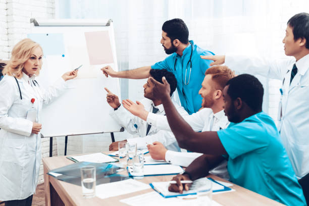 istock Teamwork Medical Consultation With Head Doctor. 1018745934