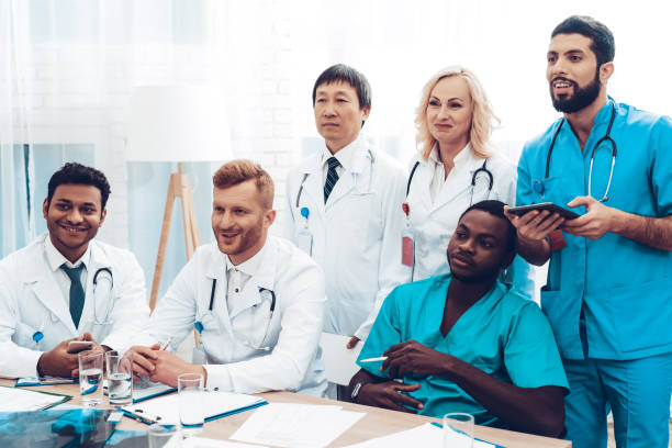 istock Multinational Doctor's Listening To Consultation. 1018745936
