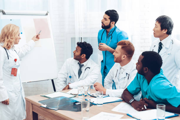 istock Teamwork Medical Consultation With Head Doctor. 1018745942