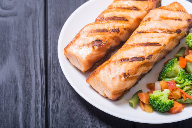 istock Grilled salmon fish with vegetables 1018746062