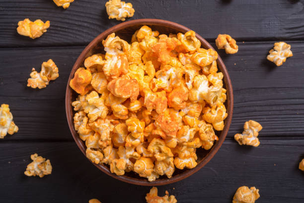 istock Yellow cheese popcorn in bowl 1018746444