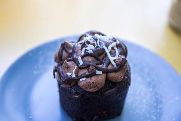 istock Chocolate muffin on the blue plate 1018746744