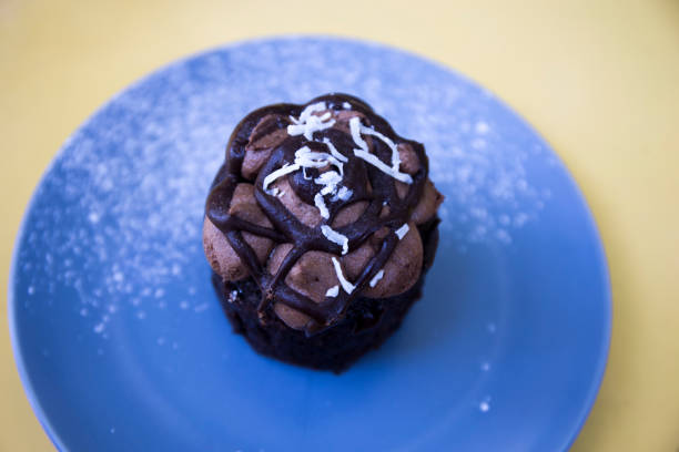 Chocolate muffin on the blue plate