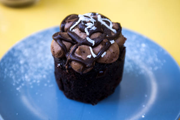istock Chocolate muffin on the blue plate 1018757436